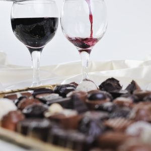 luxury and sweet praline and chocolate with wine bottle and glasses  decoration