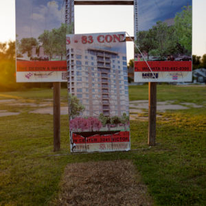 Dale Small - Access to Excess sign with the center section of a billboard for condos removed.