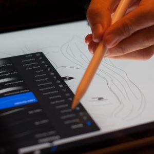 an artist draws with an iPad